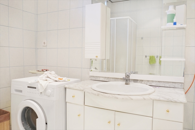 Bathroom interior with white sink and mirror